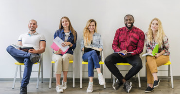 cheerful-students-posing-RECOUPEE